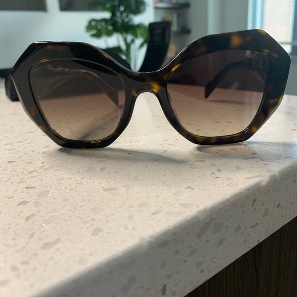 Prada 01YS sunglasses in the color Havana. main image 9